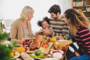 family-around-a-big-meal-with-a-turkey